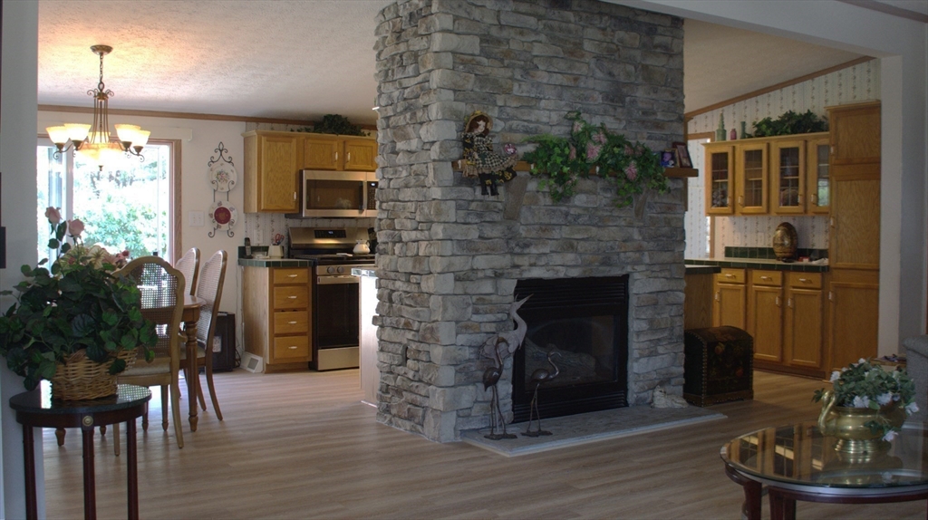 20 Deer Run Brookfield, MA 01506 - Photo 10 of 29 a living room with furniture and a fireplace