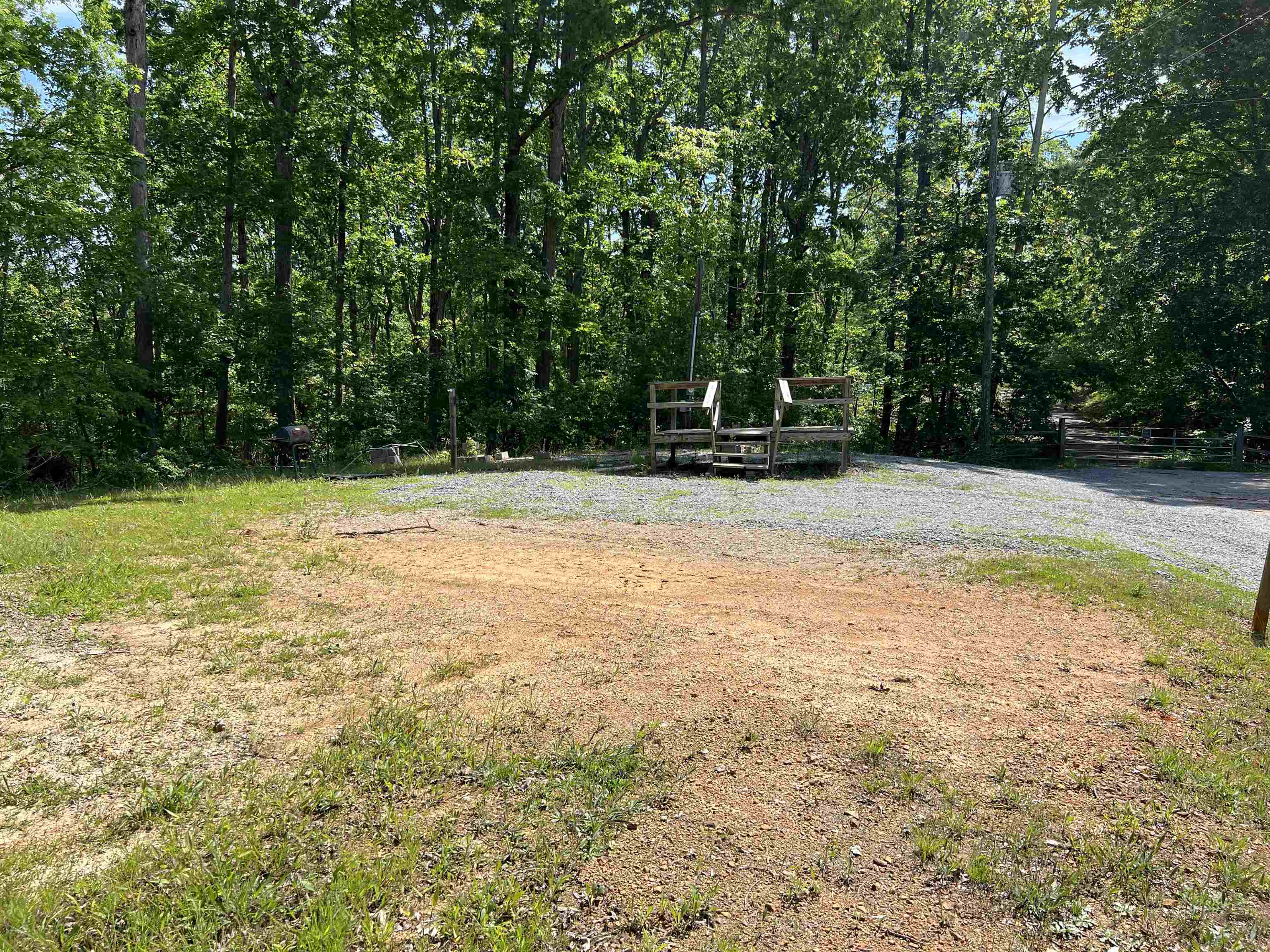 225 Micro Lane Counce, TN 38326 - Photo 2 of 7 a view of a swimming pool with a yard and large trees