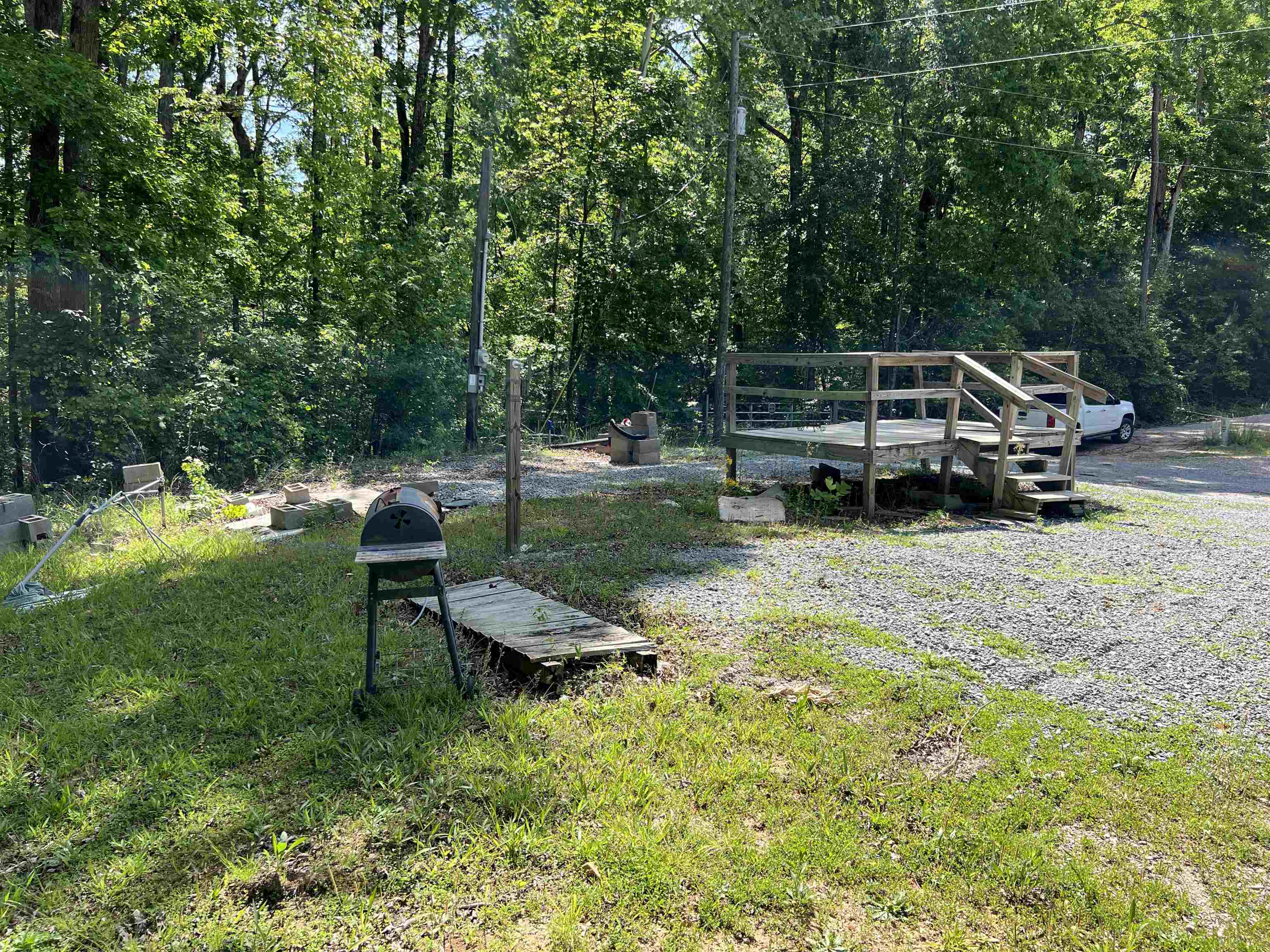 225 Micro Lane Counce, TN 38326 - Photo 3 of 7 a garden view with a bench