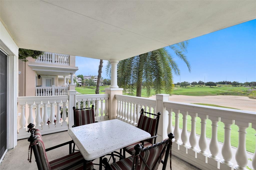 1360 Centre Ct Ridge Drive, Unit 201 Reunion, FL 34747 - Photo 24 of 29 a view of a patio with wooden floor