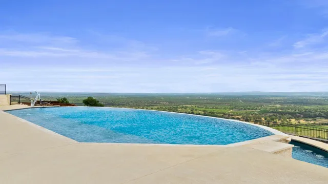 a view of a field with an ocean