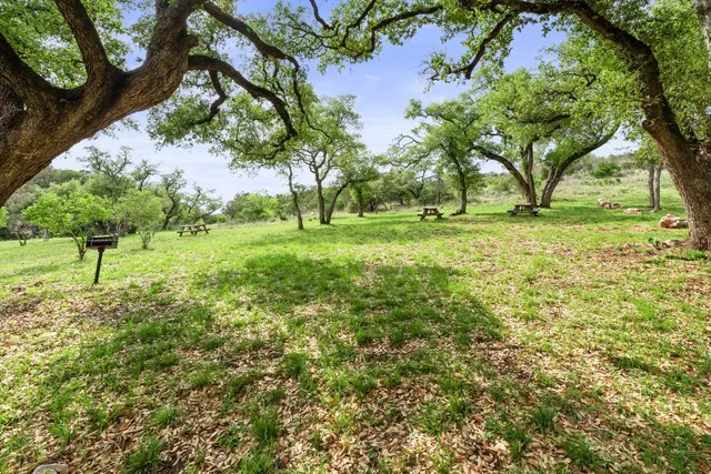 a view of swimming pool with outdoor seating