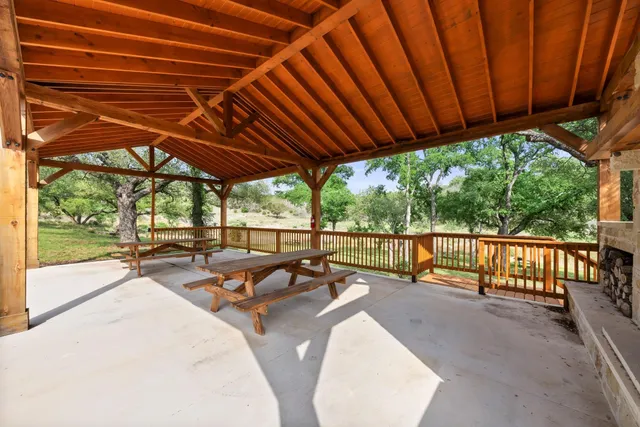 a patio with yard table and chairs