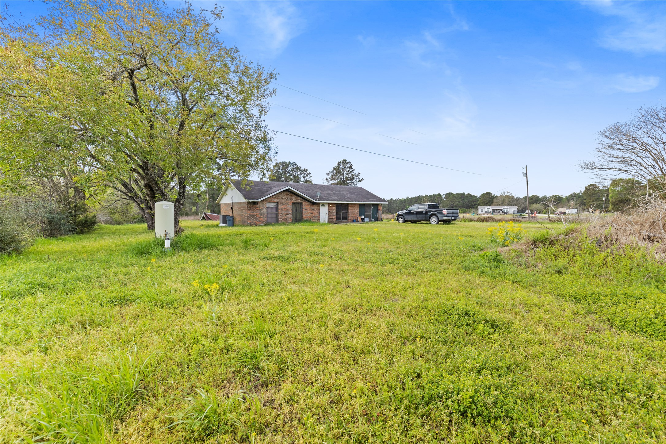 165 Davidson Road Huntsville, TX 77320 - Photo 15 of 24 a view of a street with an outdoor space and seating area