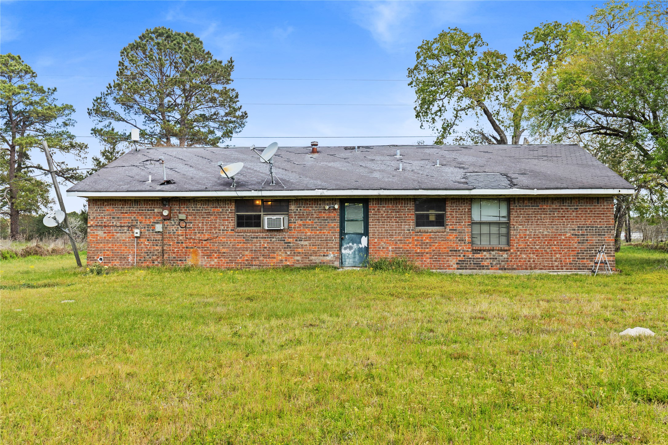 165 Davidson Road Huntsville, TX 77320 - Photo 16 of 24 a front view of a house with garden