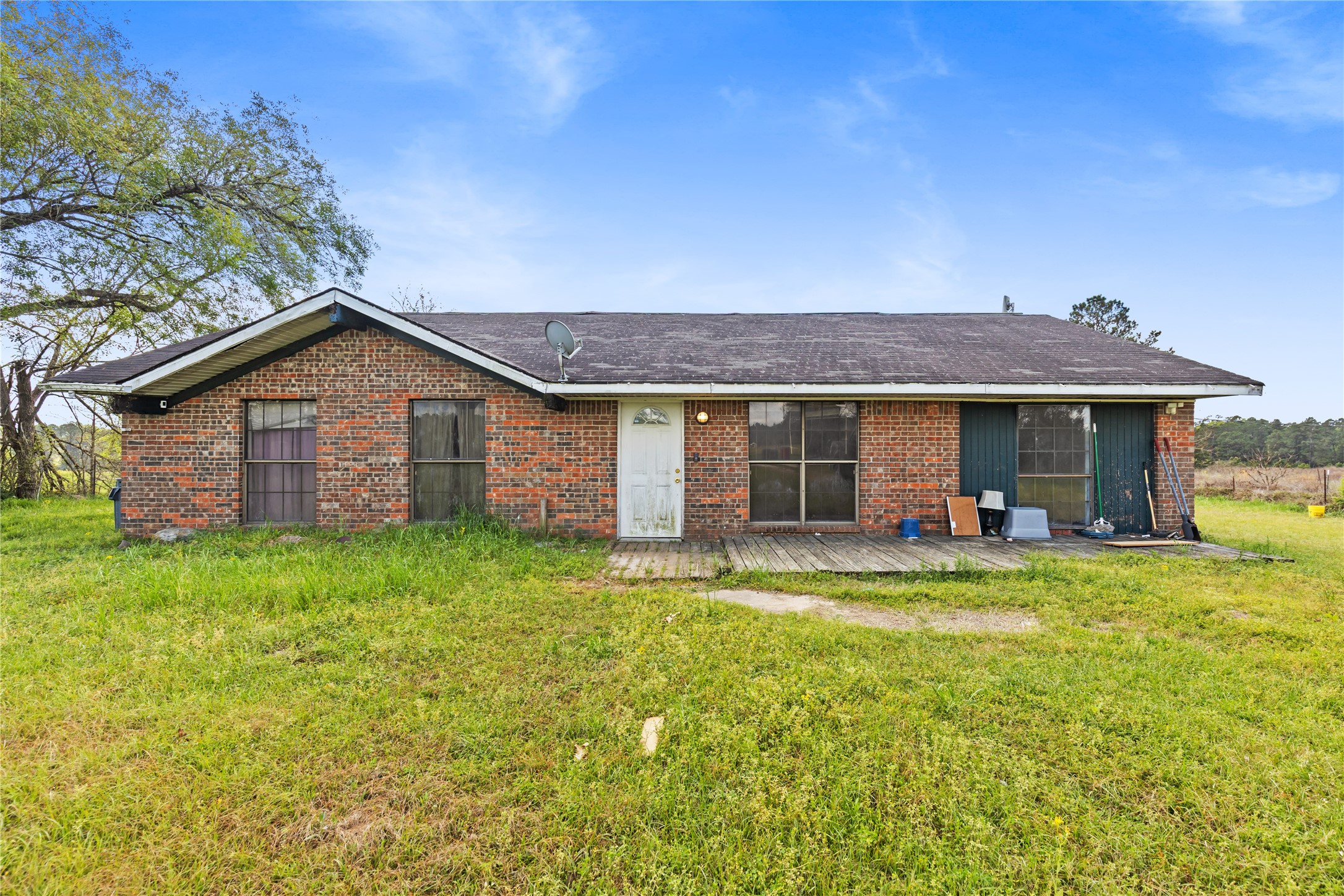 165 Davidson Road Huntsville, TX 77320 - Photo 18 of 24 a view of a house with a yard and sitting area
