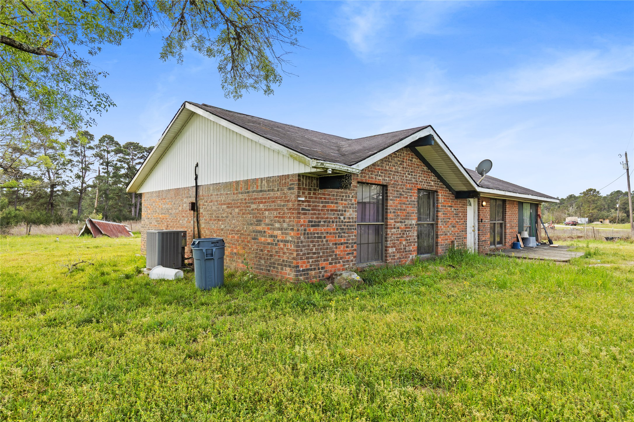 165 Davidson Road Huntsville, TX 77320 - Photo 19 of 24 a front view of a house with yard and green space