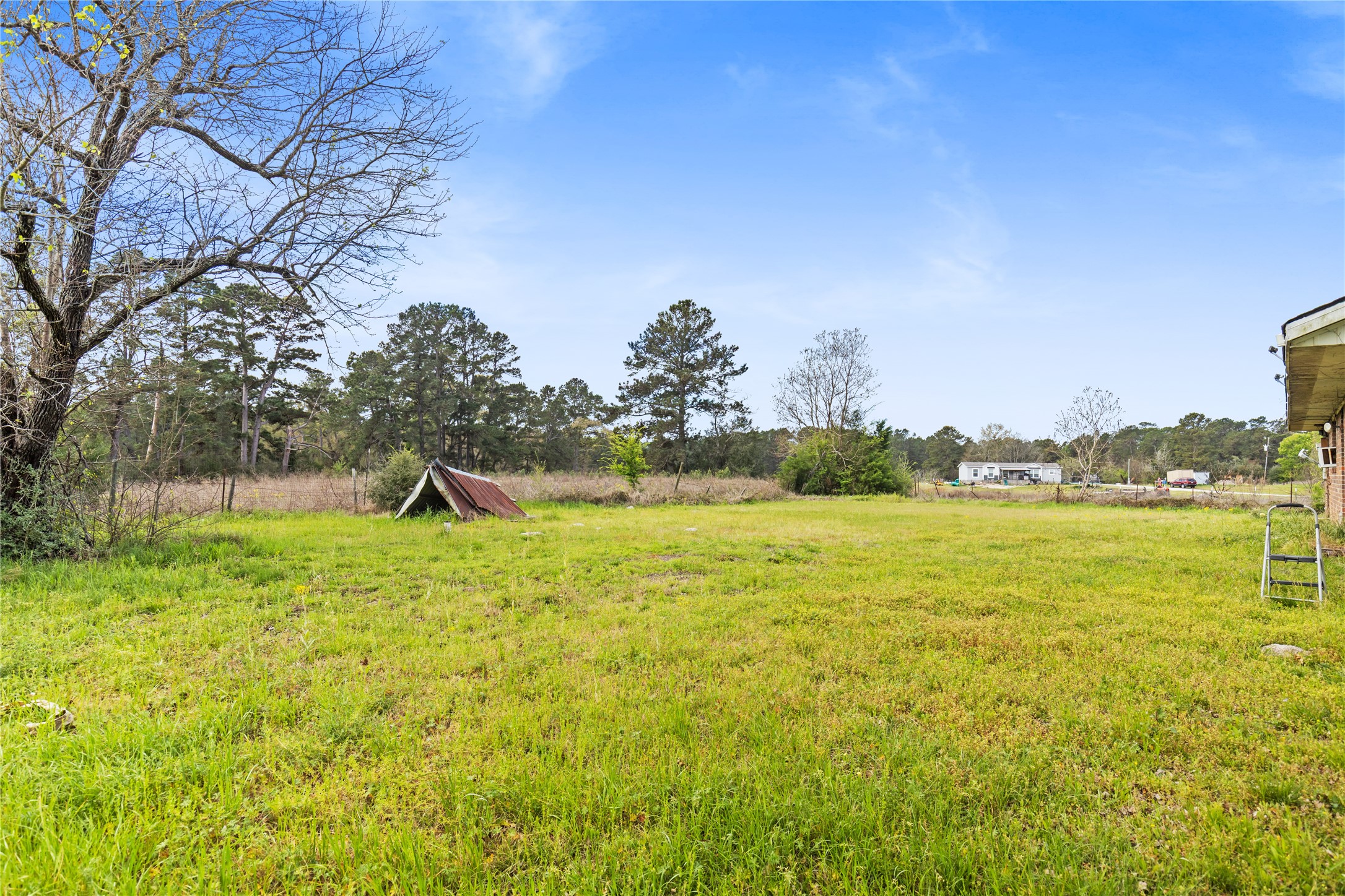 165 Davidson Road Huntsville, TX 77320 - Photo 20 of 24 a view of a lake with a big yard