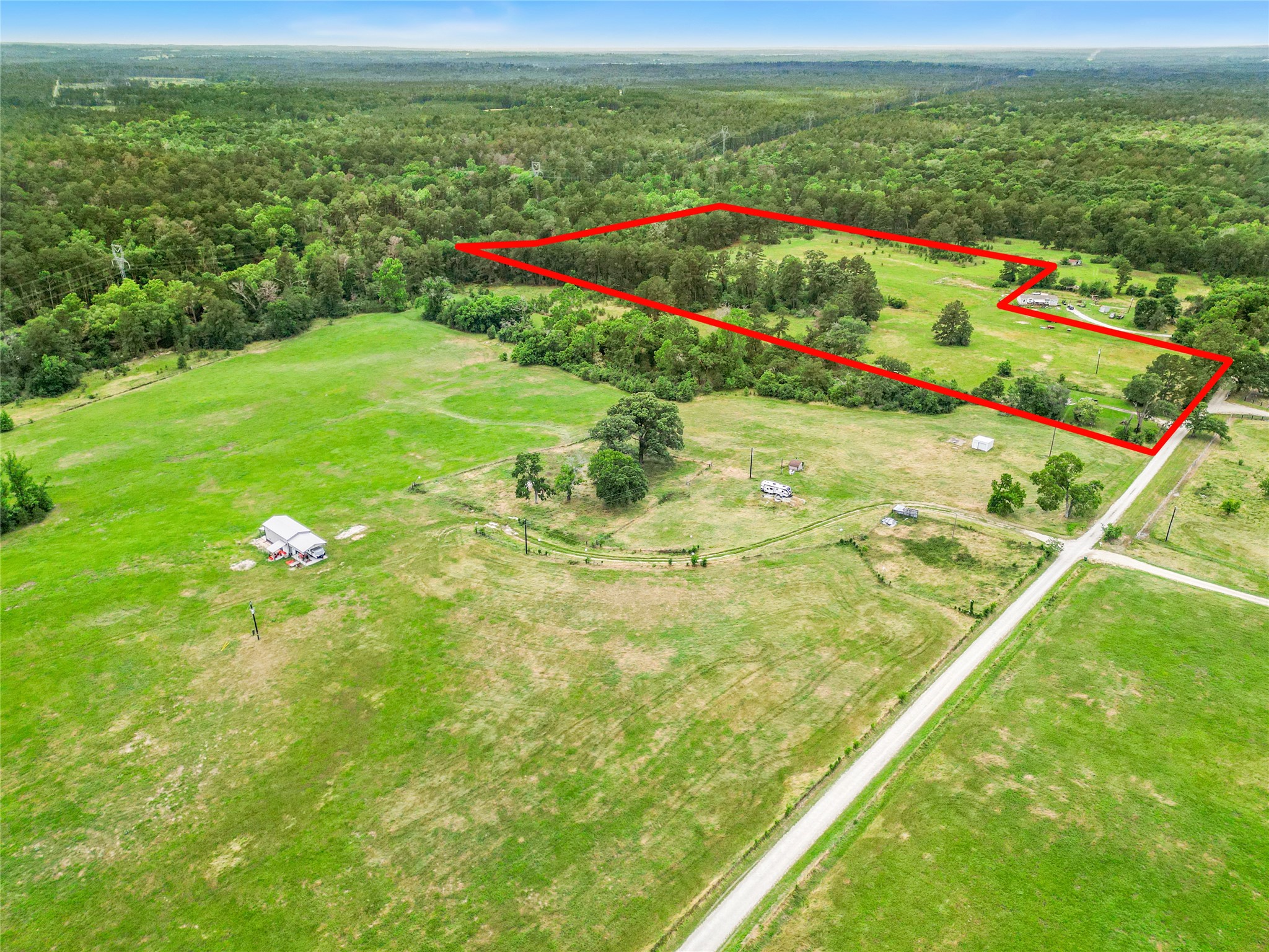165 Davidson Road Huntsville, TX 77320 - Photo 2 of 24 a view of an outdoor space and a lake view
