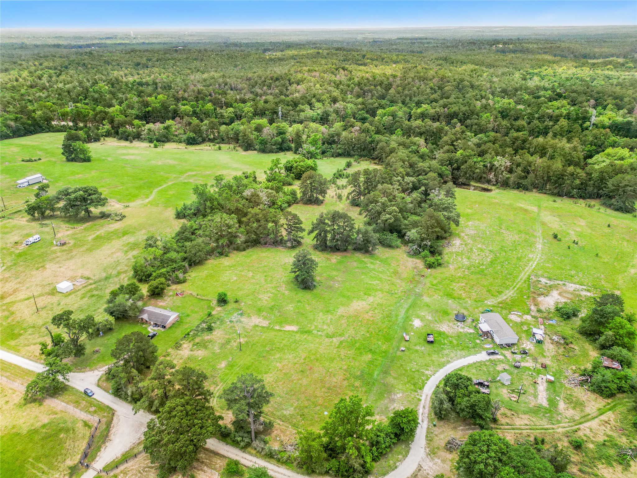 165 Davidson Road Huntsville, TX 77320 - Photo 5 of 24 a view of a green field with an ocean