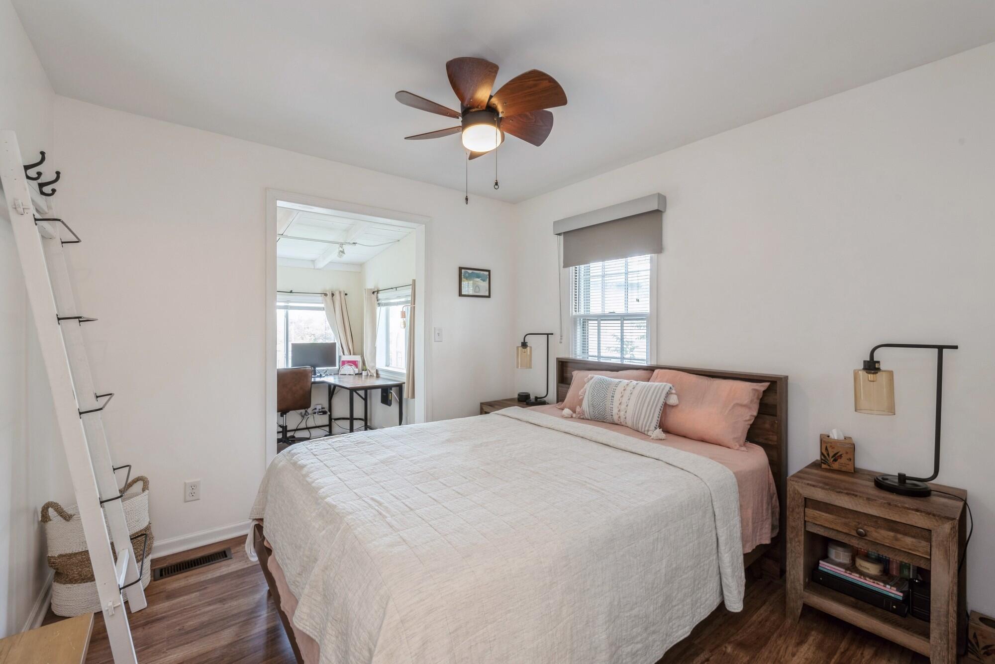 8 Turret Road Portage, IN 46368 - Photo 17 of 36 a bedroom with a bed and a chandelier