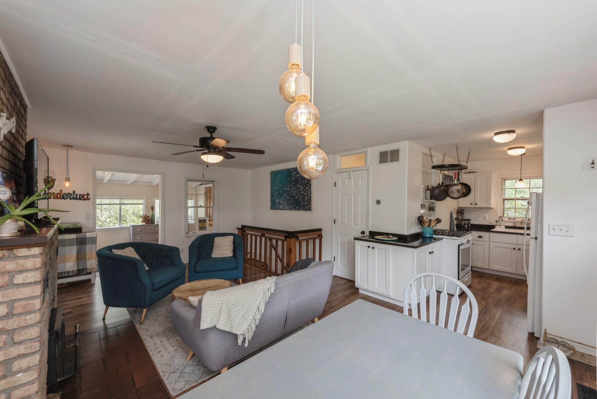 8 Turret Road Portage, IN 46368 - Photo 5 of 36 a living room with stainless steel appliances kitchen island granite countertop furniture and a chandelier