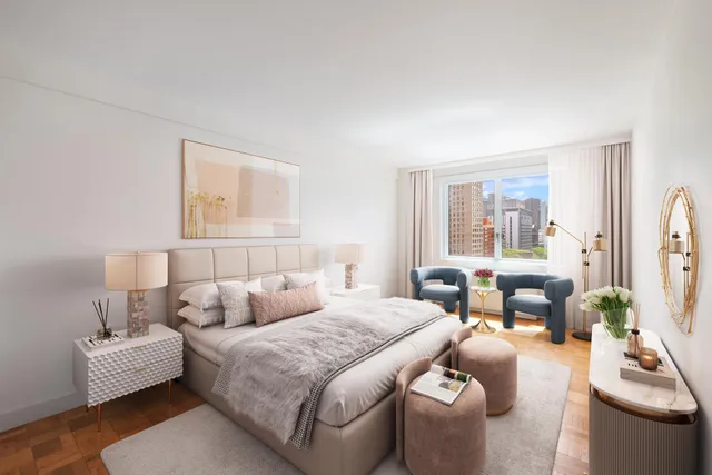 a bedroom with a bed and a couch