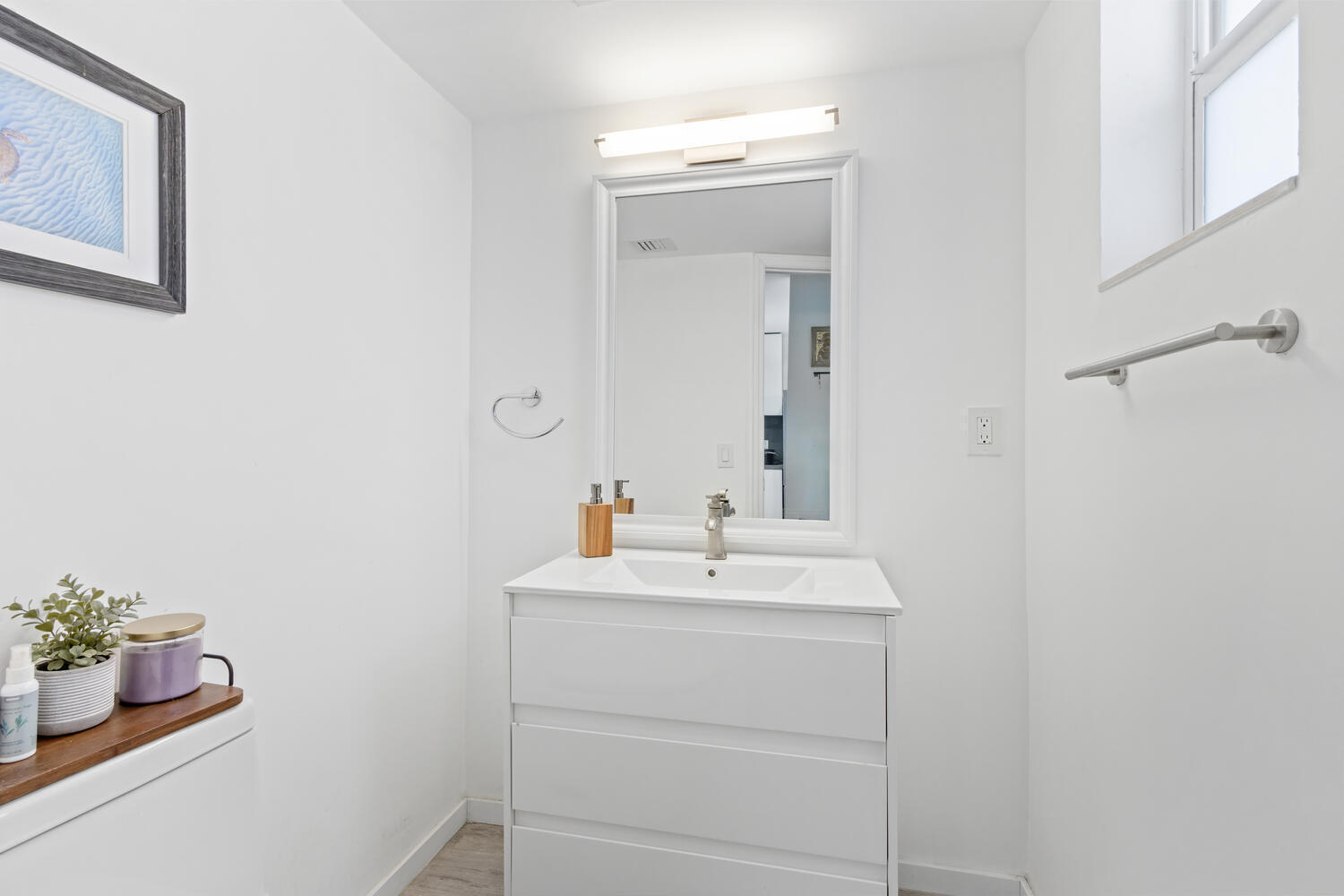 2871 North Ocean Boulevard, Unit V443 Boca Raton, FL 33431 - Photo 24 of 49 a bathroom with a sink vanity and a mirror
