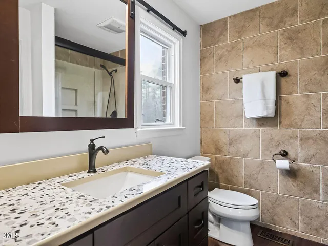 a bathroom with a sink and a toilet