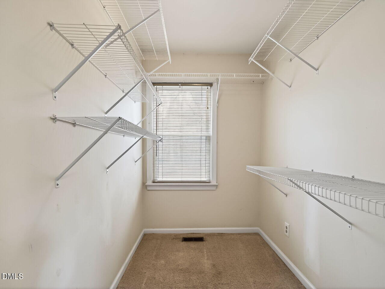 3113 Wild Forest Road Sanford, NC 27330 - Photo 23 of 32 a view of a room with rack on the wall and a window