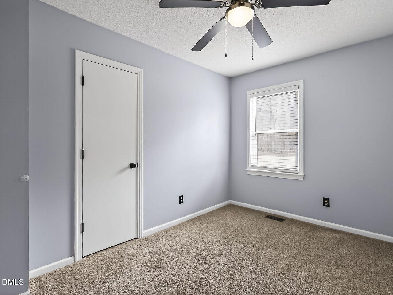 3113 Wild Forest Road Sanford, NC 27330 - Photo 24 of 32 an empty room with a window and a chandelier fan