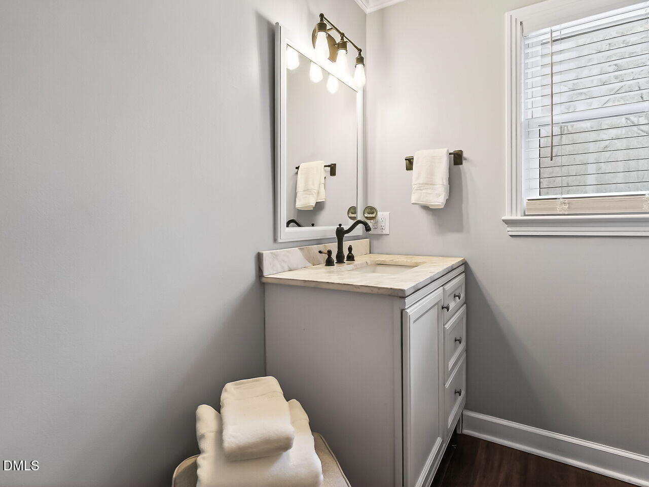 3113 Wild Forest Road Sanford, NC 27330 - Photo 25 of 32 a bathroom with a sink vanity and a mirror