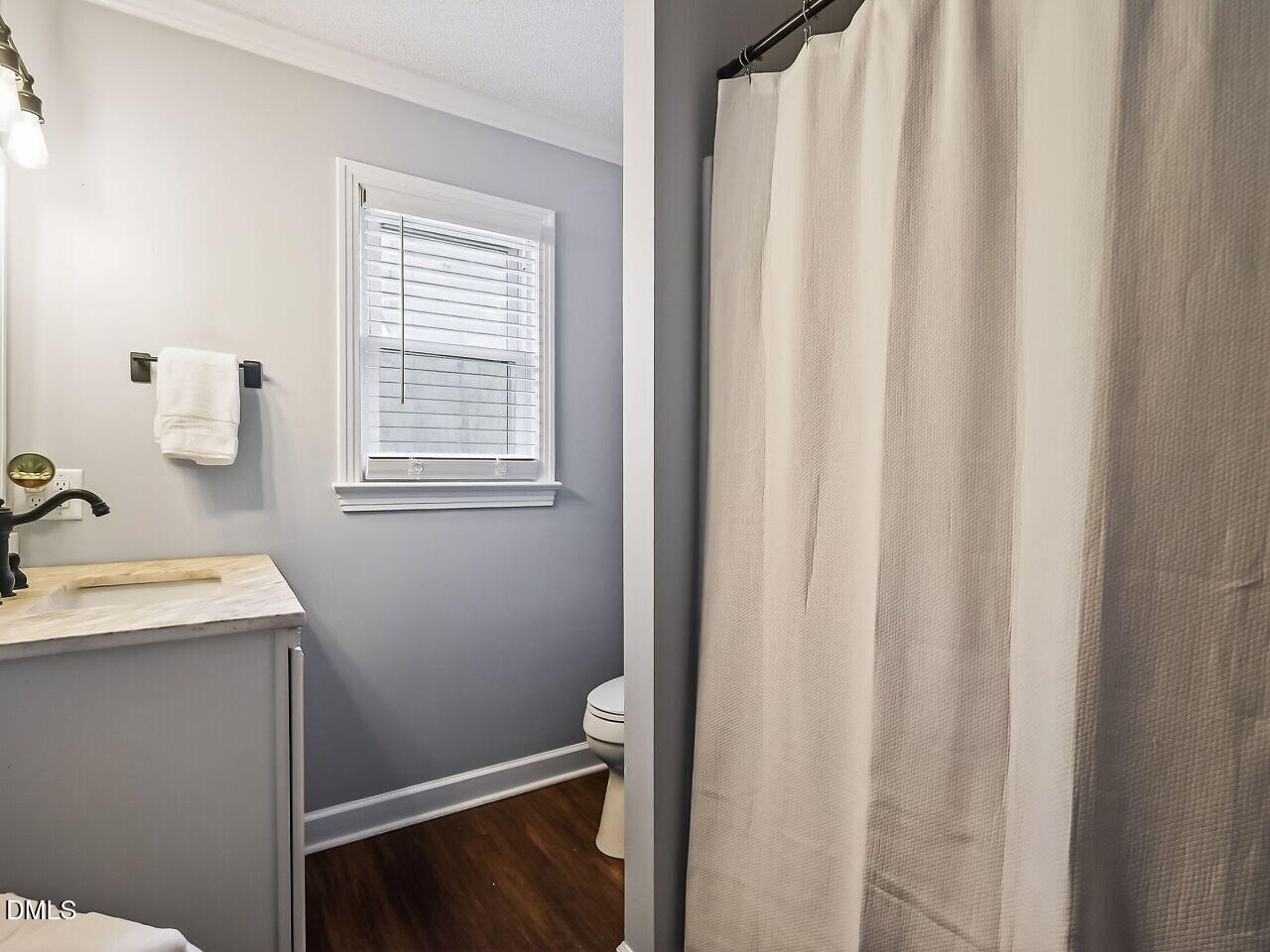 3113 Wild Forest Road Sanford, NC 27330 - Photo 26 of 32 a bathroom with a sink and a mirror