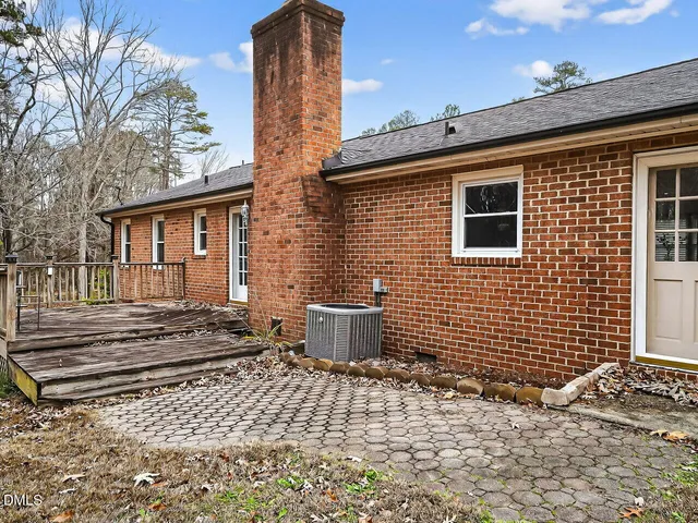 a brick building with a window and a table
