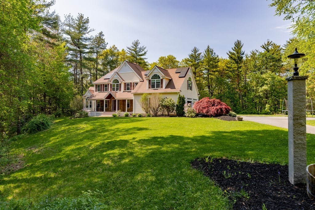 101 Stonefence Road Lunenburg, MA 01462 - Photo 1 of 41 a front view of a house with garden
