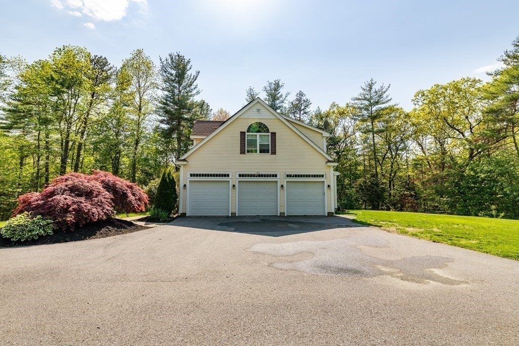 101 Stonefence Road Lunenburg, MA 01462 - Photo 12 of 41 a view of a house with a yard and large trees