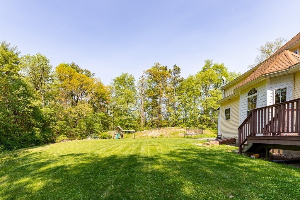 101 Stonefence Road Lunenburg, MA 01462 - Photo 13 of 41 a view of yard with swimming pool and green space