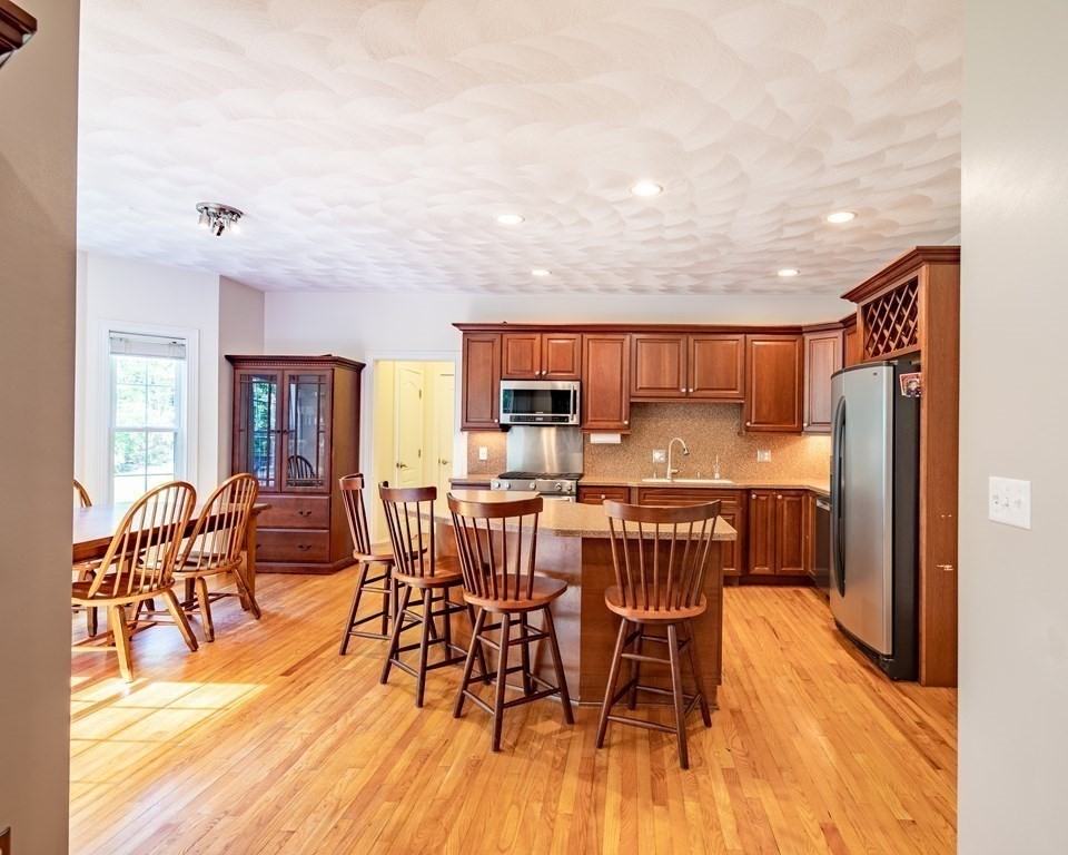 101 Stonefence Road Lunenburg, MA 01462 - Photo 20 of 41 a dining room with furniture window and wooden floor