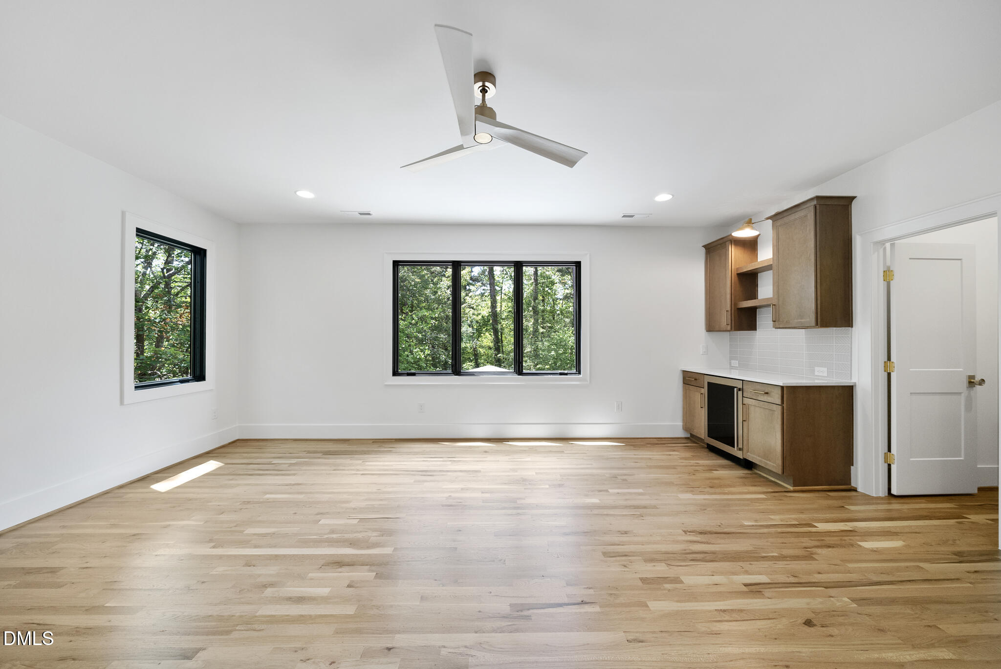 1609 Ridge Road Raleigh, NC 27607 - Photo 39 of 62 a view of an empty room with a window and wooden floor