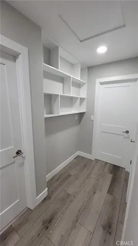 an empty room with wooden floor