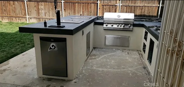 a view of a kitchen with a sink and cabinets