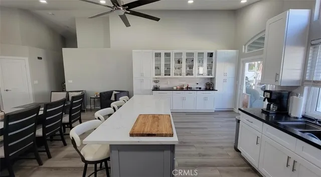 a kitchen with sink refrigerator and cabinets