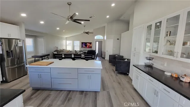 a kitchen with stainless steel appliances a sink stove and refrigerator