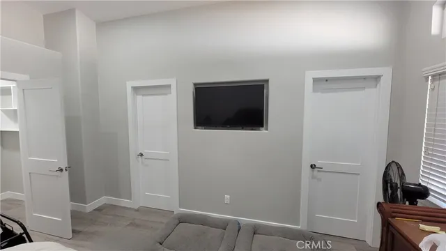 a view of a livingroom with a sink and mirror