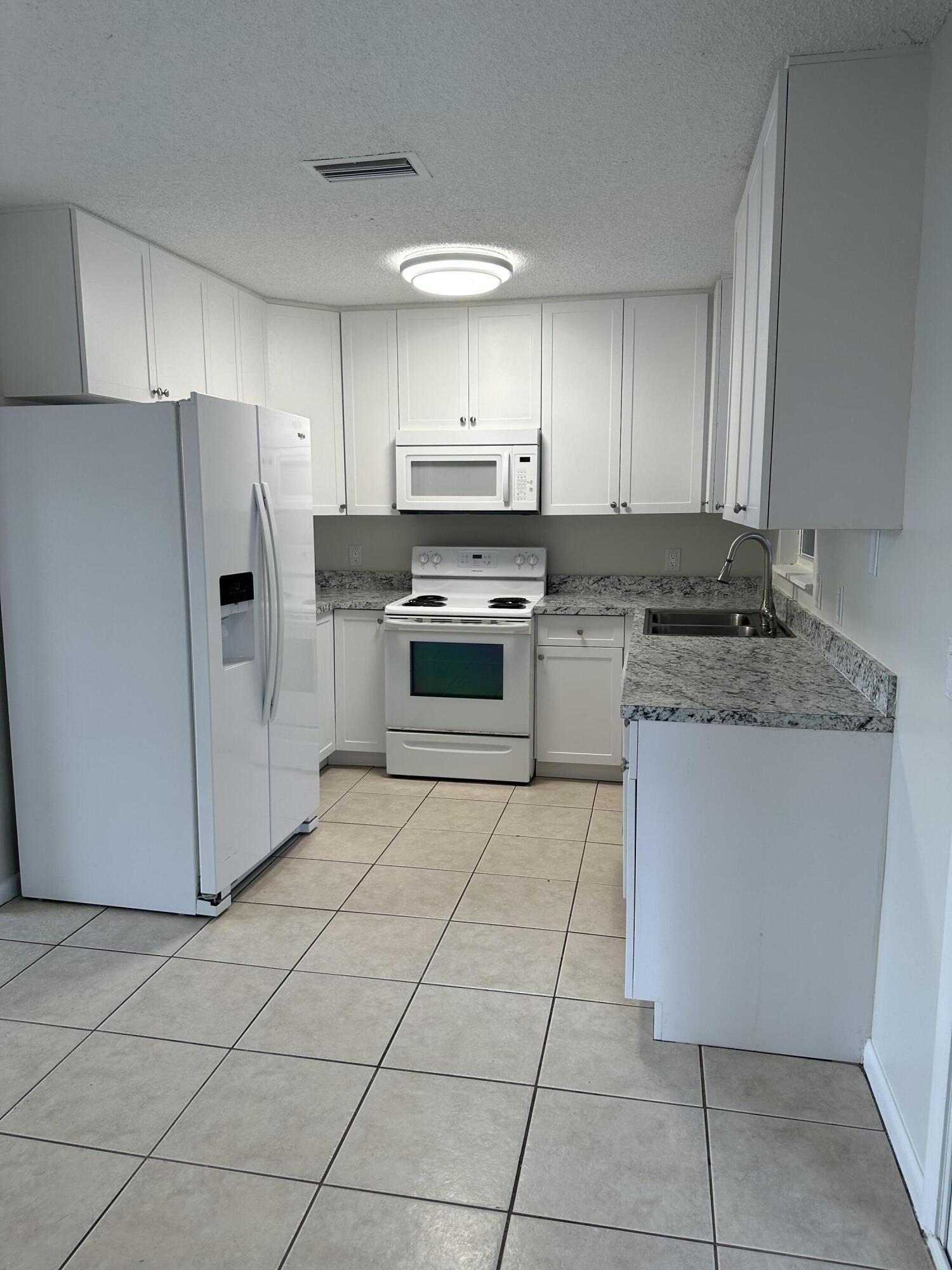 932 Southwest Bay State Road Port St. Lucie, FL 34953 - Photo 2 of 11 Bay State Kitchen