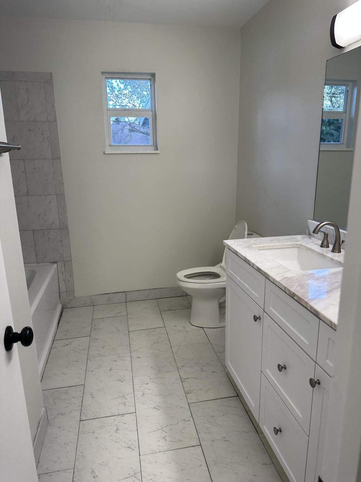 932 Southwest Bay State Road Port St. Lucie, FL 34953 - Photo 3 of 11 Bay State Bathroom