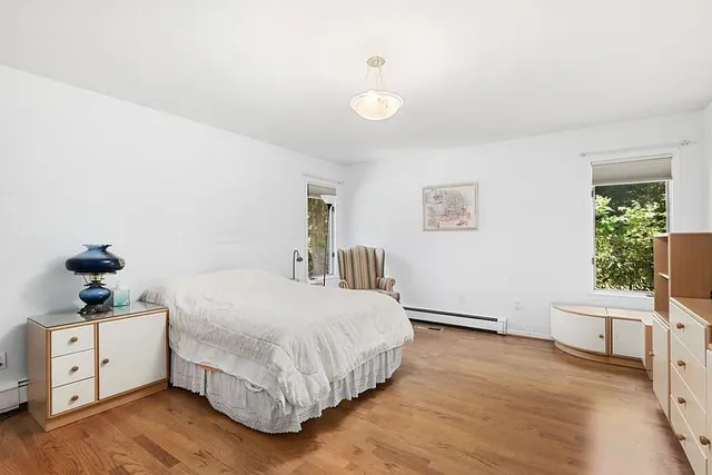 a bedroom with a bed and a table