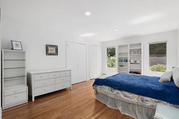 a living room with furniture window and wooden floor