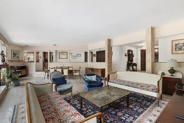 a living room with furniture and a rug