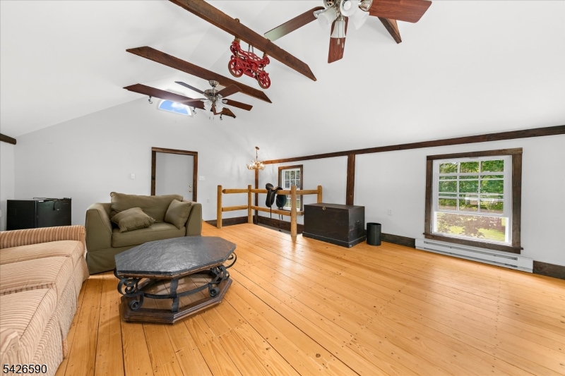 179 Lindbergh Road Hopewell, NJ 08525 - Photo 34 of 46 a living room with furniture and a ceiling fan