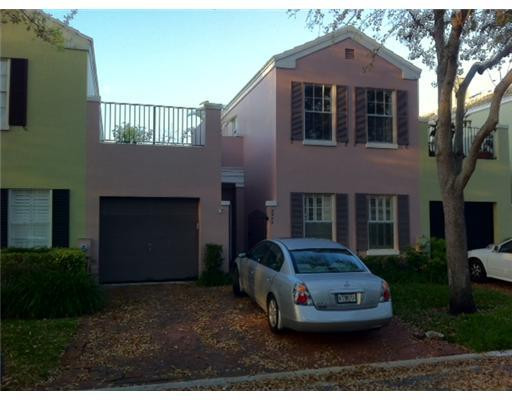 5955 Catesby Street, Unit 34 Boca Raton, FL 33433 - Photo 1 of 16 a front view of a house with a garden