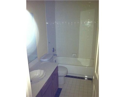 5955 Catesby Street, Unit 34 Boca Raton, FL 33433 - Photo 11 of 16 a bathroom with a sink a toilet and tub