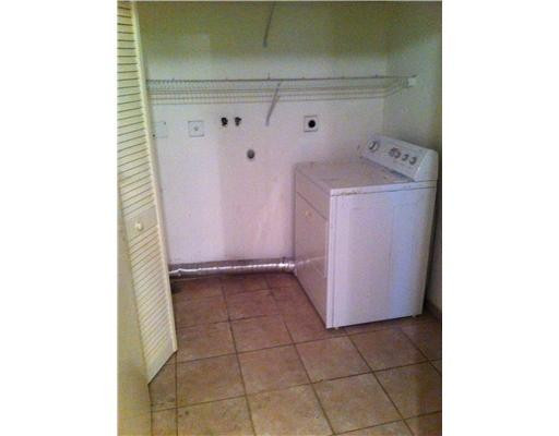 5955 Catesby Street, Unit 34 Boca Raton, FL 33433 - Photo 13 of 16 a utility room with dryer and washer