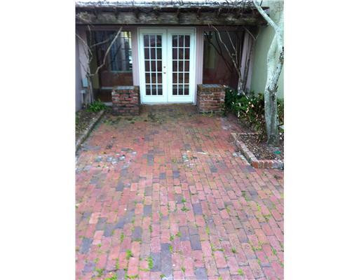 5955 Catesby Street, Unit 34 Boca Raton, FL 33433 - Photo 14 of 16 a view of a brick house with large windows