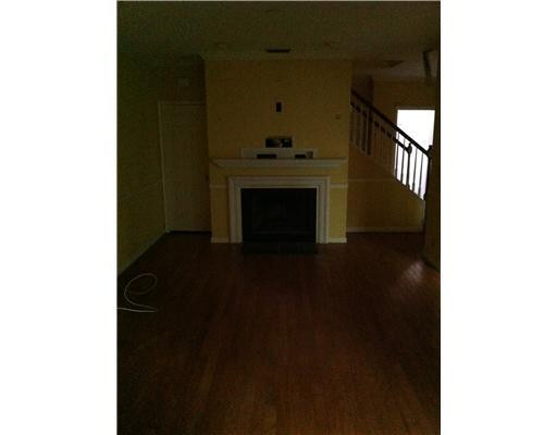 5955 Catesby Street, Unit 34 Boca Raton, FL 33433 - Photo 2 of 16 a living room with a fireplace