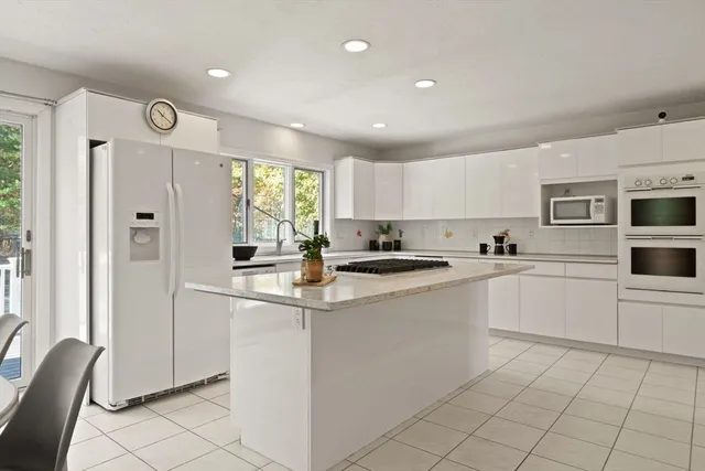 a kitchen with cabinets and window