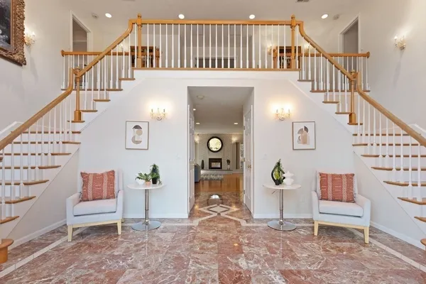 a view of entryway livingroom and hall