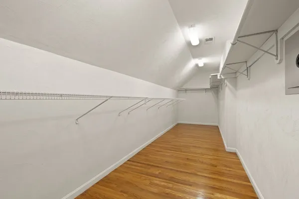 a view of a hallway with stairs