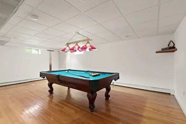 a room with furniture and pool table