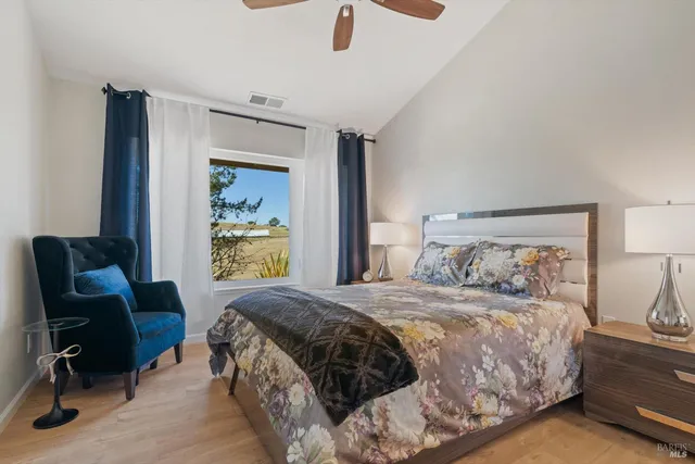a bathroom with a granite countertop sink a mirror and a shower